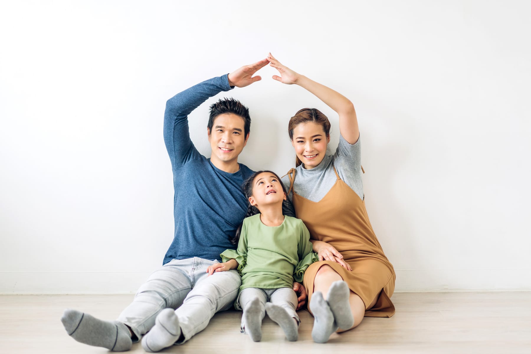 A happy family sitting together at home